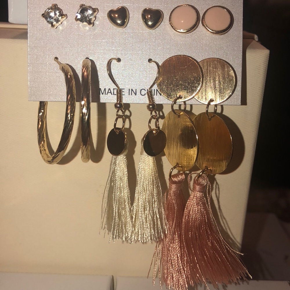 Blush pink and beige tassel and hoop earrings.